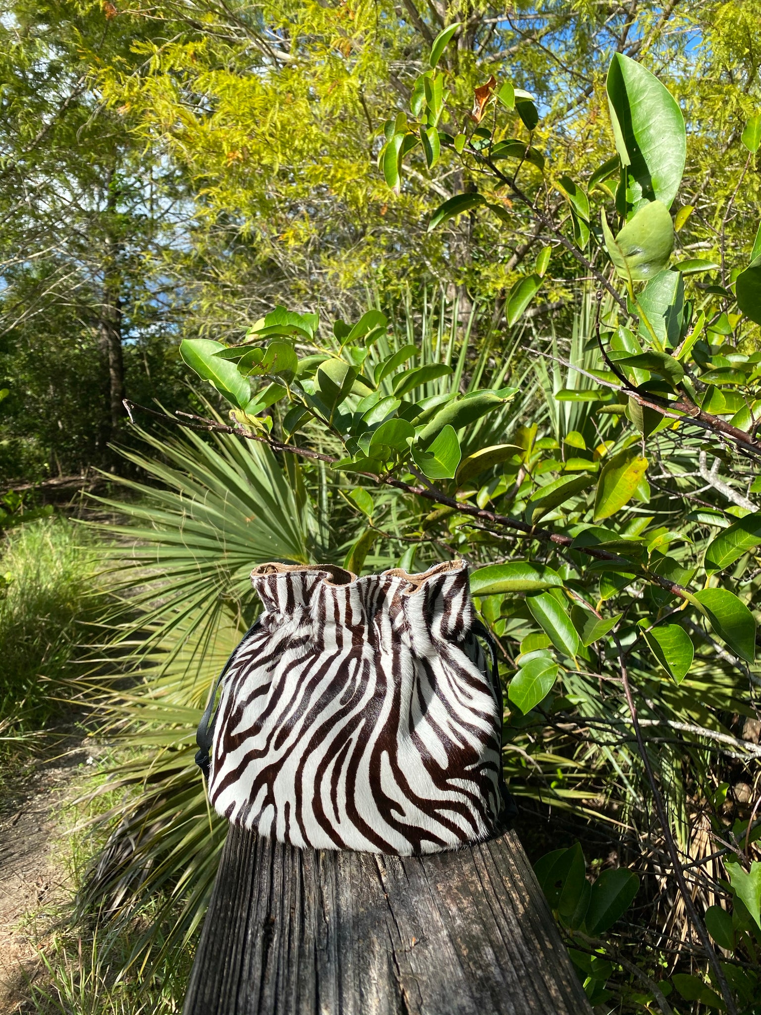 MINI DRAWSTRING POUCH. CALF HAIR, GENUINE LEATHER